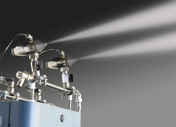 It uses compressed air to create very fine aerosols from two nozzles
